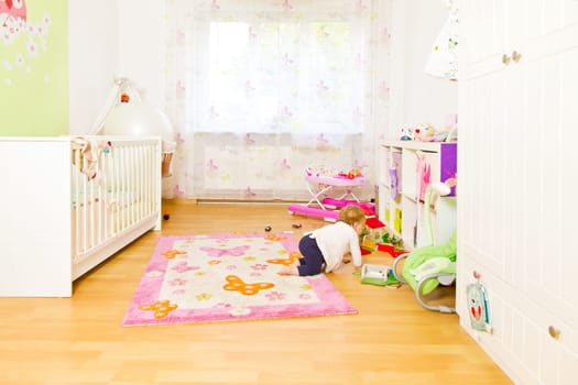 Baby in the cheerful nursery