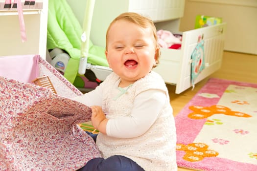 Little on a journey of discovery in the children's room