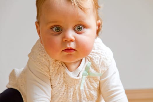 Baby crawling on the wooden floor