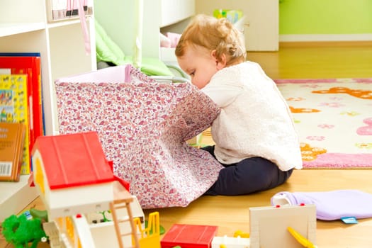 Little on a journey of discovery in the children's room