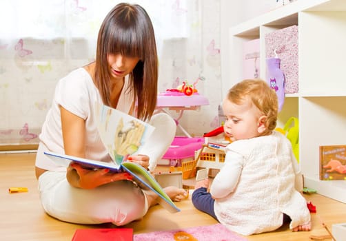 Mother and child with picture book