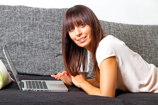 Young modern woman on laptop
