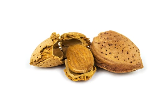 Almond with broken shell,close-up of the nut on a white background