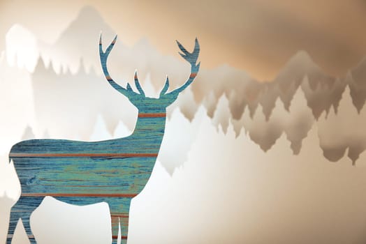 Merry christmas new year handmade paper cut greeting card with wood pattern deer silhouette and winter forest landscape background.