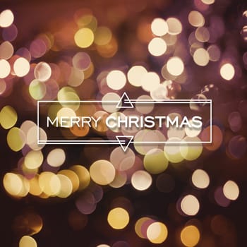 Merry christmas card, text label with cute geometry elements on gold bokeh light background. Ideal for holiday season greetings, xmas poster or web.