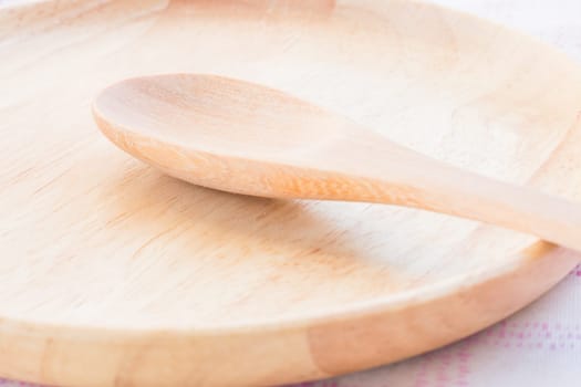 Set of wooden spoon and plate