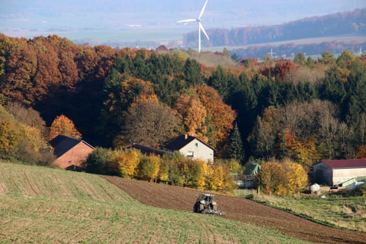 Autumn landscape with tractor