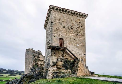 Castle of Santa Gadea del Cid with a dark sky in Burgos, Spain