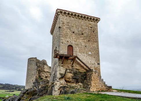 Castle of Santa Gadea del Cid with a dark sky in Burgos, Spain