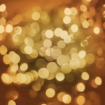 Gold sparkle blur light elegant retro background. Ideal for holiday greeting card, event or party invitation.