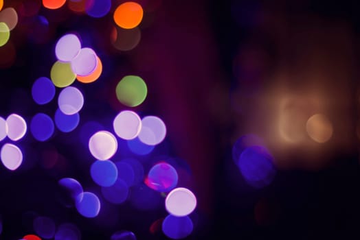 Colorful Christmas lights with bokeh blur effect, abstract background. Ideal for holiday greeting card, event invitation or web backdrop.   .