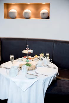 A table at restaurant set for family