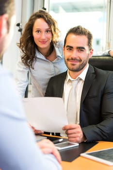 VIew of a Attractive boss doing interview with his assistant
