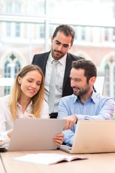 View of a Group of business people working together at the office