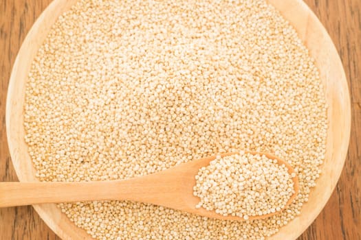 Quinoa grain in wooden plate, stock photo