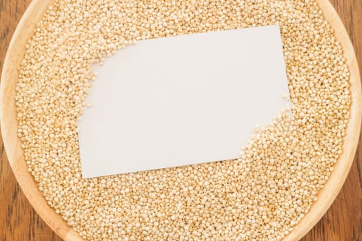 Organic quinoa grain and business card, stock photo