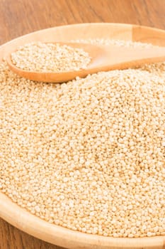 Quinoa grain in wooden plate, stock photo