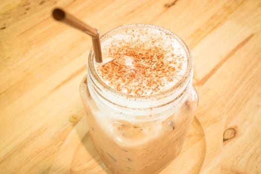 Iced cofee mocha drink serving on wooden table, stock photo
