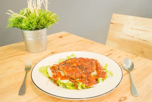 Fried pork with barbeque sauce spicy salad, stock photo
