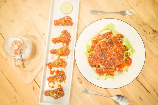 Set of spicy barbeque pork, chicken and iced coffee, stock photo