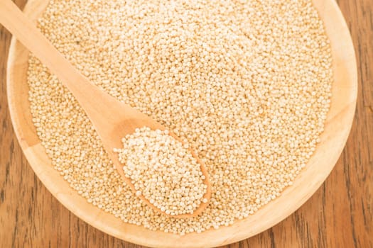 Quinoa grain in wooden plate, stock photo