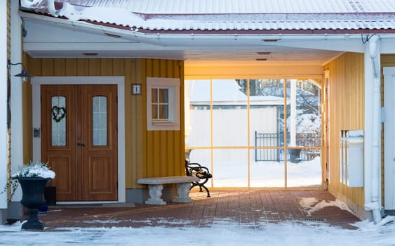 Entrance to House in Winter with snow.
