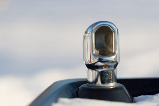 Drinking fountain with Snow and white/grey background.