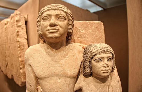 Egyptian limestone Old Kingdom statue of a couple for their tomb