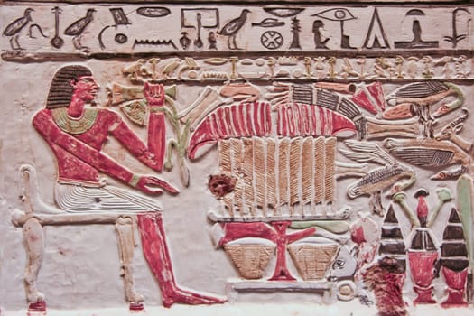 An Ancient Egyptian painted and carved relief on a wall