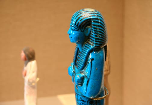 Blue faience ancient egyptian figurine at museum