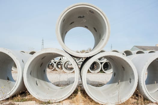 Concrete drainage pipes for industrial building construction.
