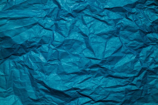blue Crumpled paper background. Place for text.