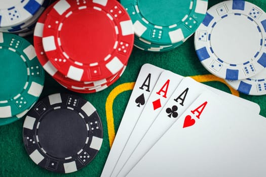 poker four aces on green casino table