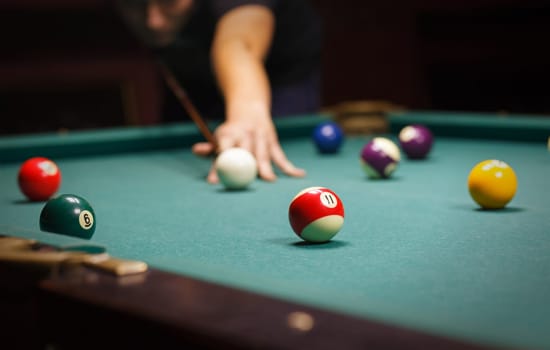 Playing billiard - Close-up shot of a man playing billiard