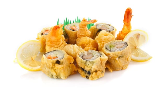 fried shrimp with sushi roll and lemon isolated