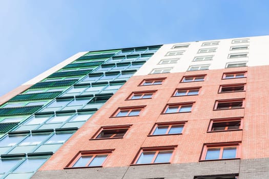 Panorama and perspective View the colorful facade of a high-rise residential apartment.