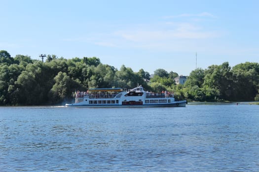 beautiful landscape with promenade motor ship on the river