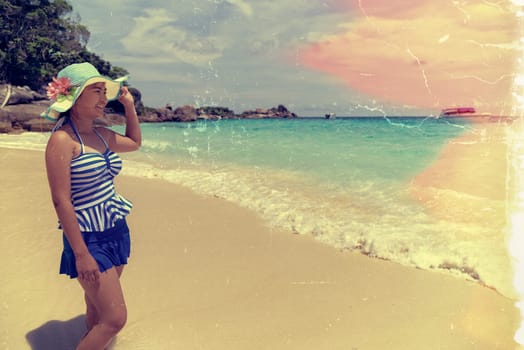 Old photos made by adding effects and textures, Retro style beautiful woman in swimsuit standing on beach and sea during summer at Miang Island in Mu Ko Similan National Park, Phang Nga, Thailand