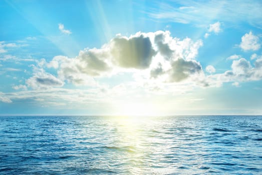 Sea with blue water, sky and clouds. Seascape