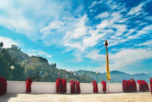 Monks in red robes in the indian monastery