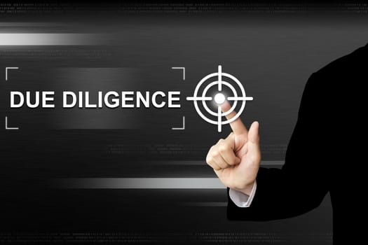 business hand clicking due diligence button on a touch screen interface