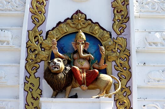 Idol of Ganesha sitting on lion at Bada Ganapati Temple, Indore, Madhya Pradesh, India, Asia