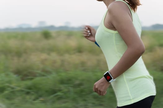women wear smart hand watch running motion blur conceptt