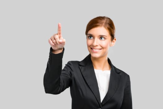 Beautiful businesswoman pointing