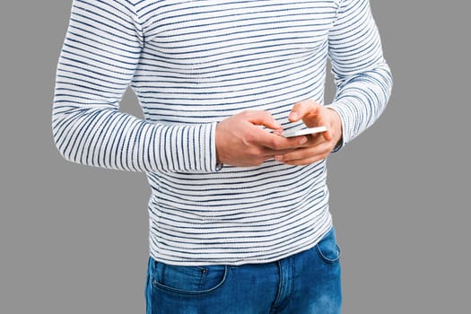 Young man sending a text message, isolated on white background