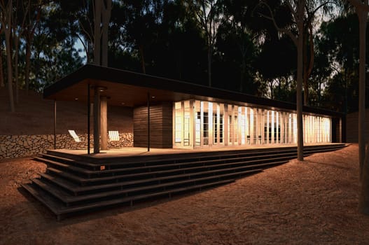 Modern wood House in the forest. Late afternoon almost night time.
