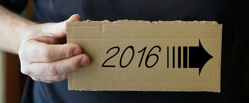 Cardboard sign with the year 2016
