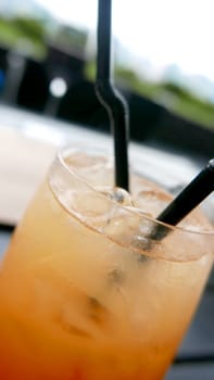 orange juice with ice closeup