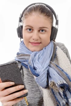 a young woman listening to music with his mobile phone