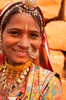 Portrait of smiling traditional Indian woman in sari dress, India people